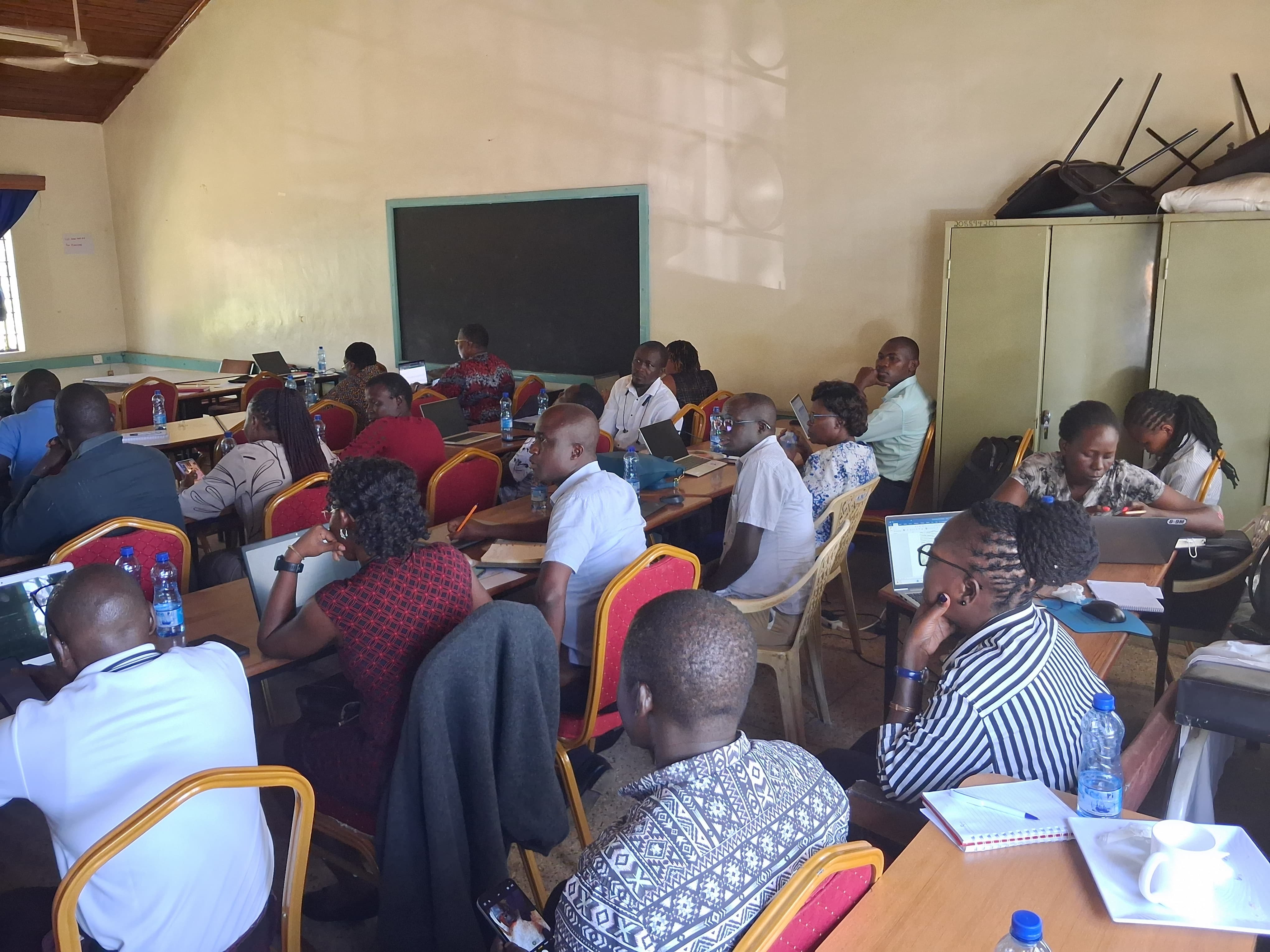 Meeting participants working on laptops and taking notes during the County Key and Vulnerable Populations Technical Working Group meeting at KCRH Hall
